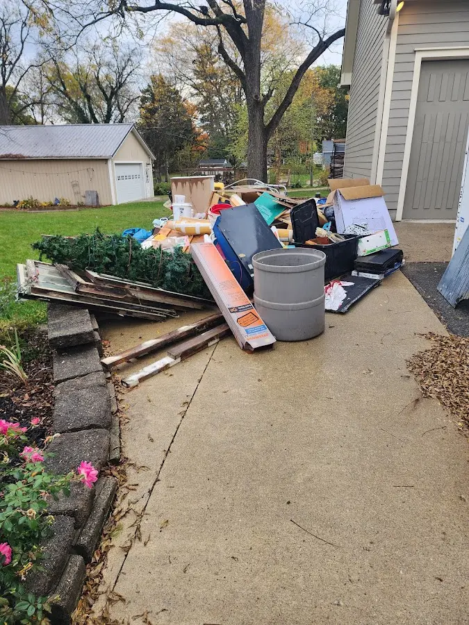 Dumpster being loaded with debris for 30 Yard Dumpster Rental in Newbern